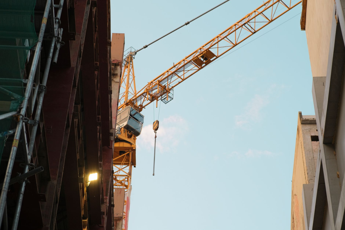 A construction crane dominates the urban skyline of Bratislava, Slovakia.